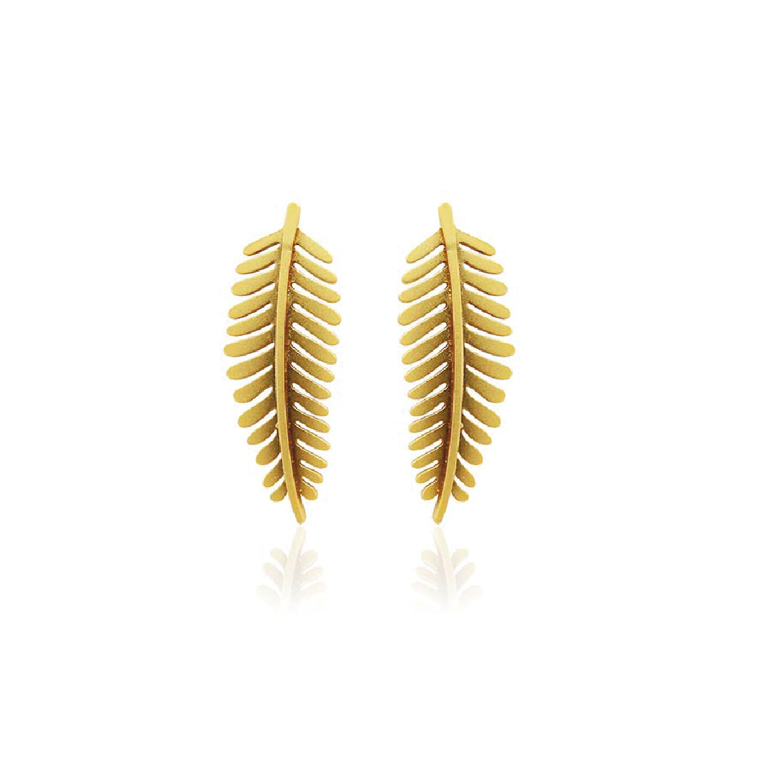 Golden fern-shaped earrings on a white background