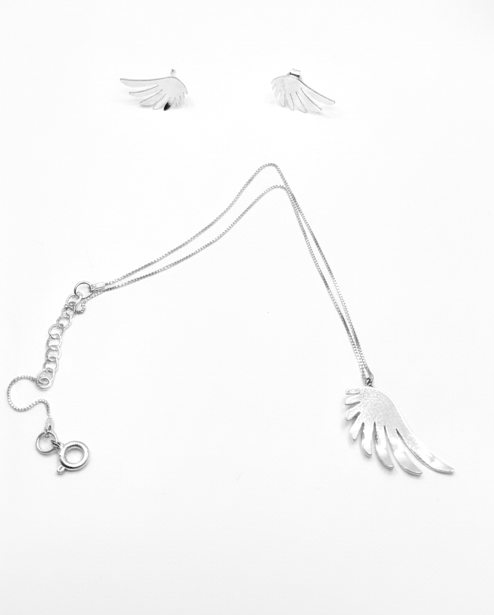 Silver necklace with leaf-like pendants on a white background