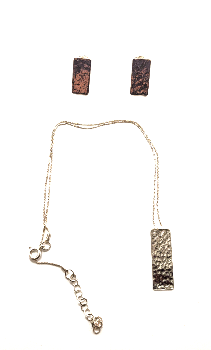 Necklace and earrings set with rectangular pendants on a white background