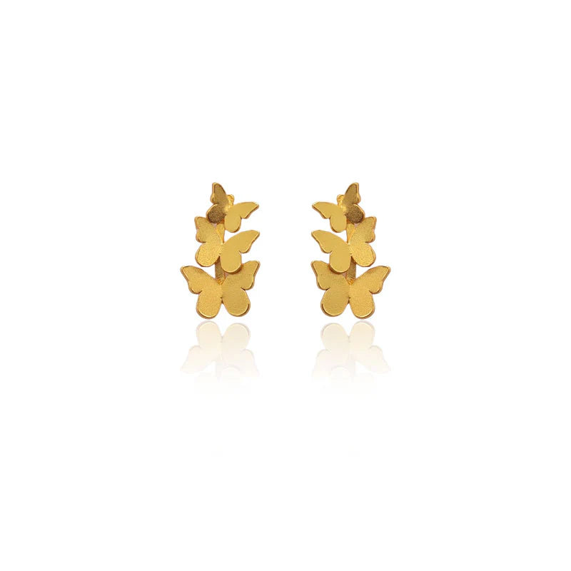 Triple Butterfly Gold earrings on a white background